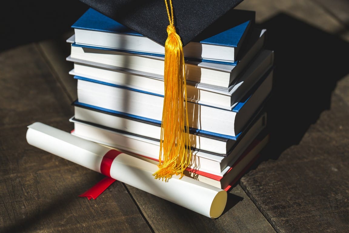 grad-cap-diploma-and-books-stacked_4460x4460